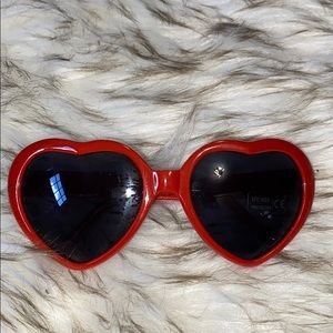 Red heart sunglasses with UV tag still on them